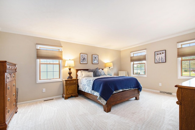 bedroom featuring light carpet, visible vents, baseboards, and ornamental molding