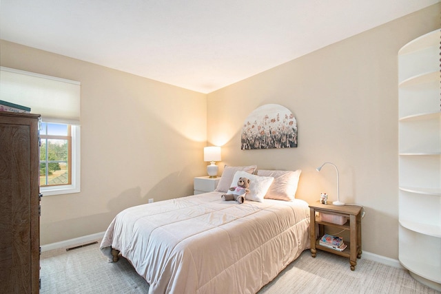 bedroom featuring visible vents, baseboards, and carpet flooring