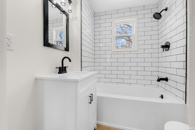 bathroom with tub / shower combination and vanity