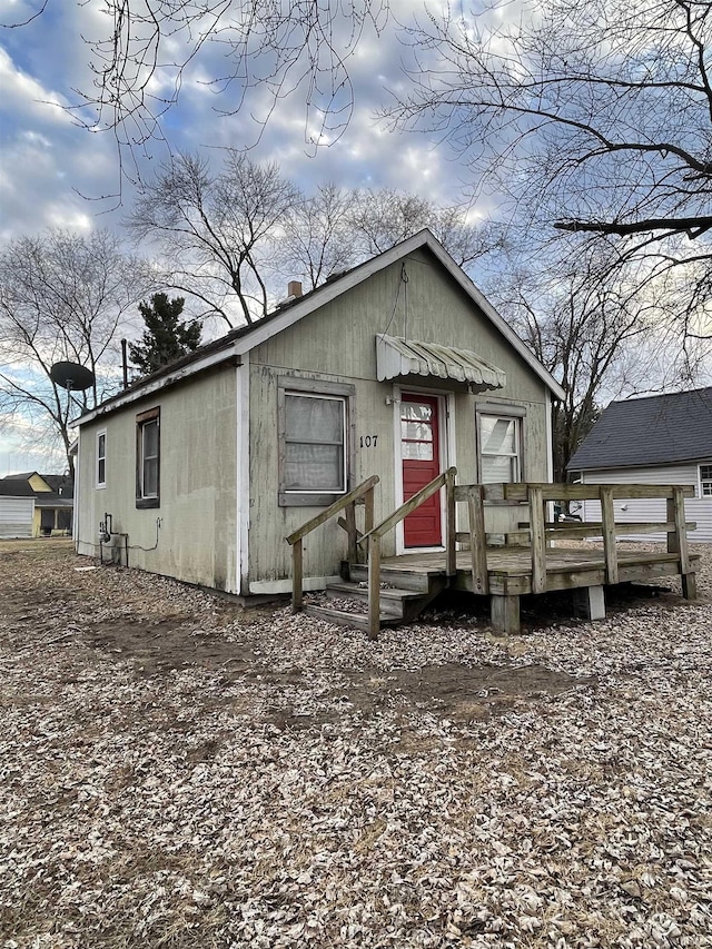 view of front of property with a wooden deck