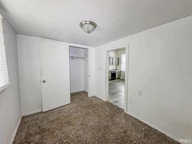 233 W 4th St, Greensburg, IN 47240 - unfurnished bedroom featuring a closet and carpet