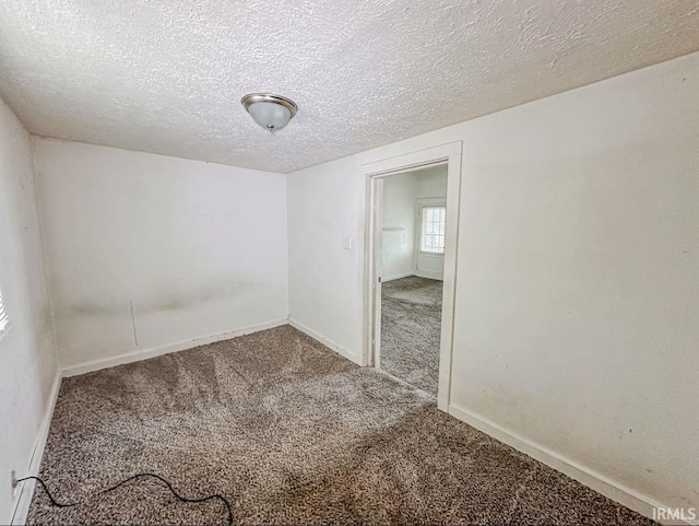 233 W 4th St, Greensburg, IN 47240 - carpeted spare room featuring a textured ceiling and baseboards