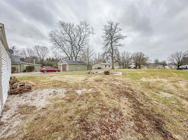233 W 4th St, Greensburg, IN 47240 - view of yard featuring a fire pit and an outbuilding