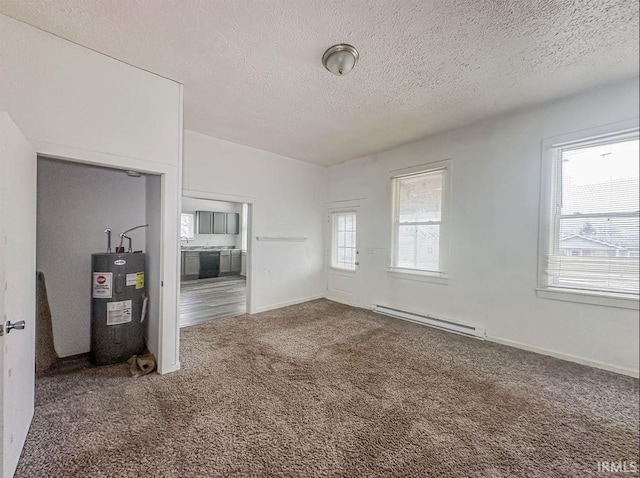 233 W 4th St, Greensburg, IN 47240 - unfurnished living room with a textured ceiling, electric water heater, carpet floors, baseboards, and baseboard heating