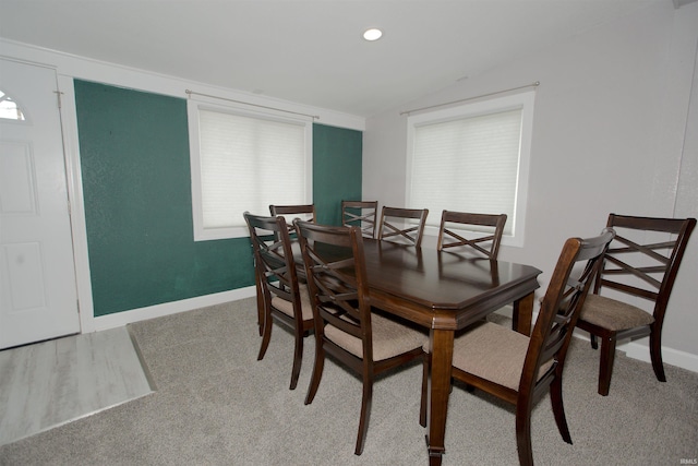 dining area featuring lofted ceiling, recessed lighting, and baseboards