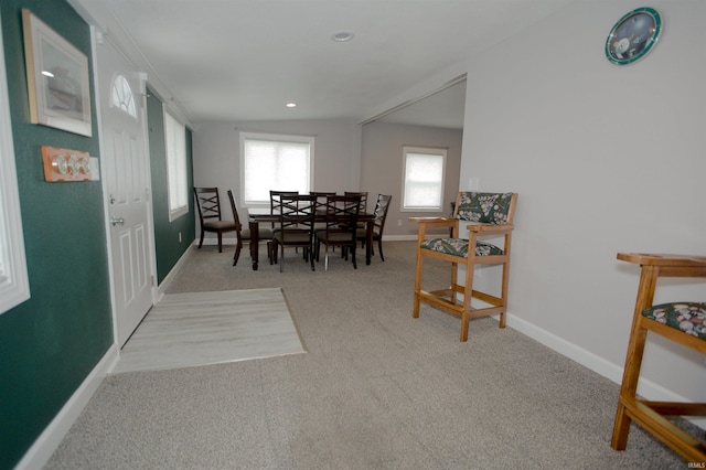 carpeted dining area featuring baseboards and recessed lighting