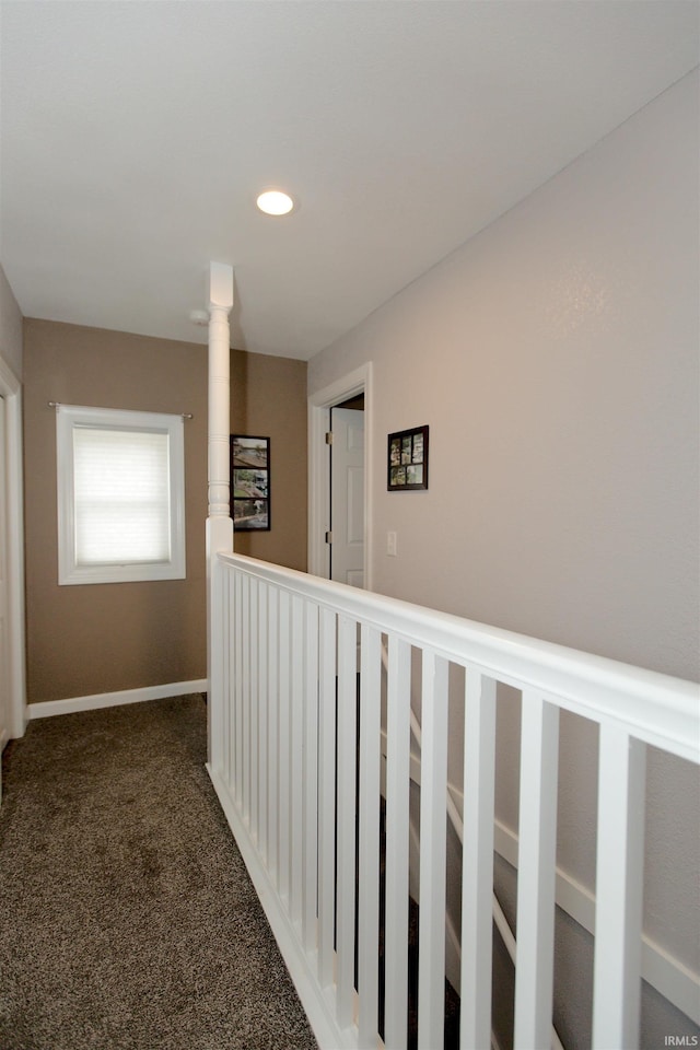 corridor featuring carpet, baseboards, and recessed lighting