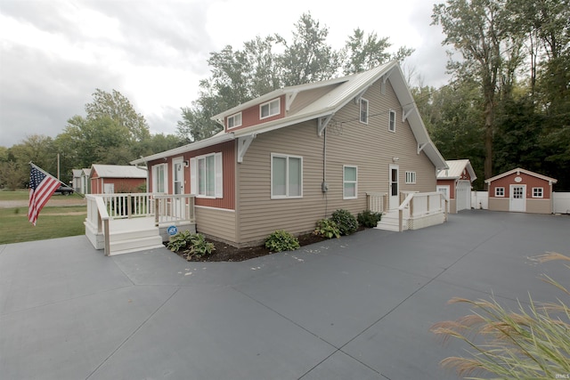 exterior space with an outdoor structure and a wooden deck