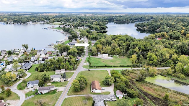 bird's eye view with a water view and a view of trees