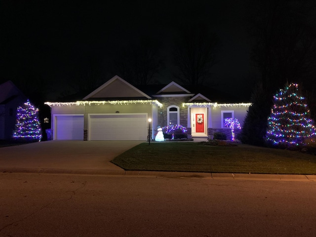 view of front facade with driveway and an attached garage