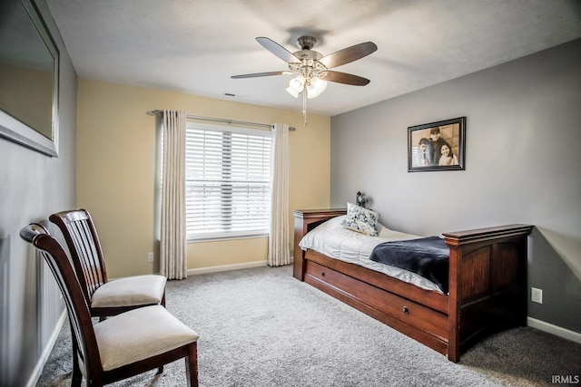 bedroom featuring carpet floors, ceiling fan, and baseboards