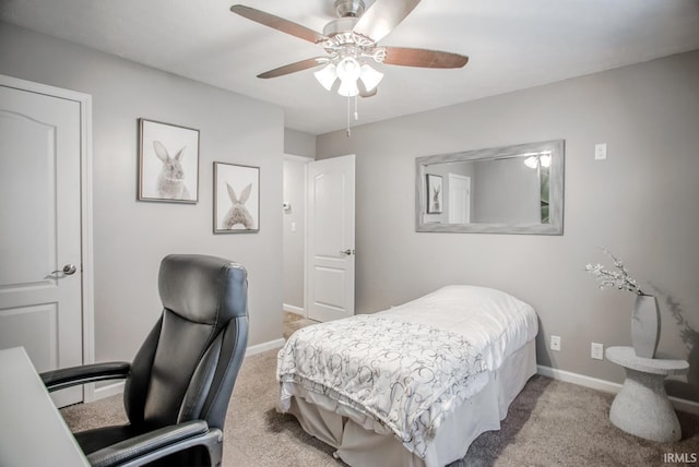 carpeted bedroom with baseboards and a ceiling fan