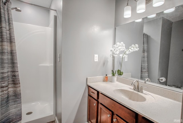 full bathroom with vanity and a shower with shower curtain