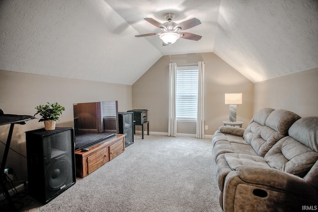 living area featuring a textured ceiling, lofted ceiling, carpet flooring, a ceiling fan, and baseboards