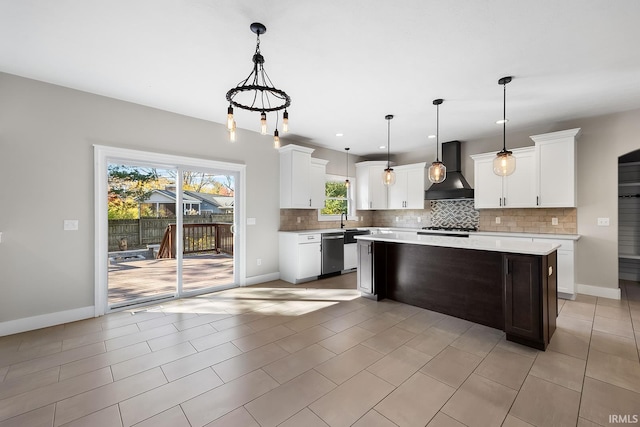 kitchen with dishwasher, a center island, light countertops, premium range hood, and backsplash