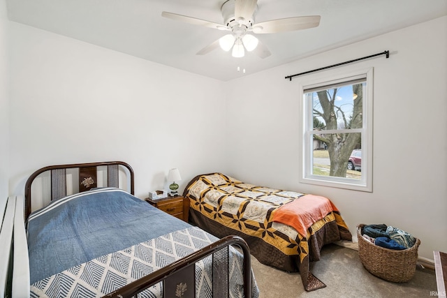 carpeted bedroom with a ceiling fan