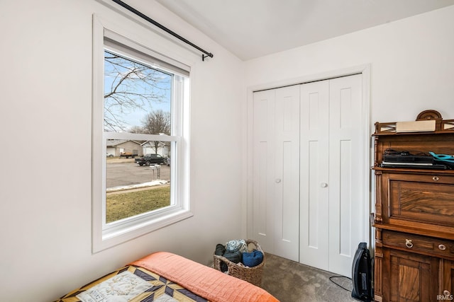 bedroom featuring a closet and carpet flooring