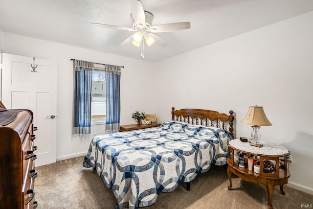 carpeted bedroom featuring ceiling fan and baseboards