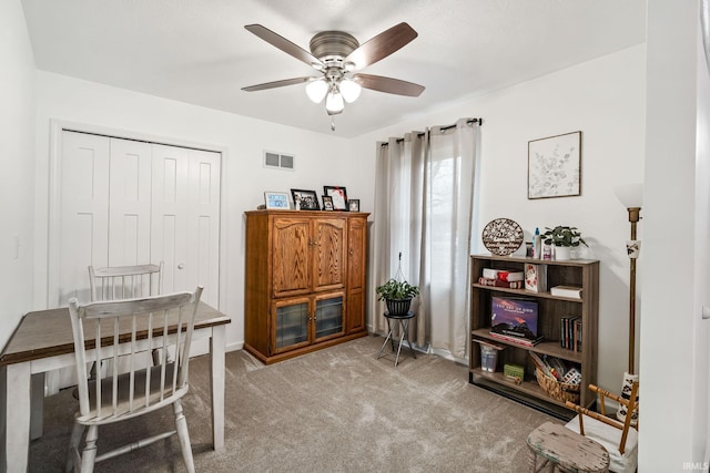 office with ceiling fan, carpet, and visible vents