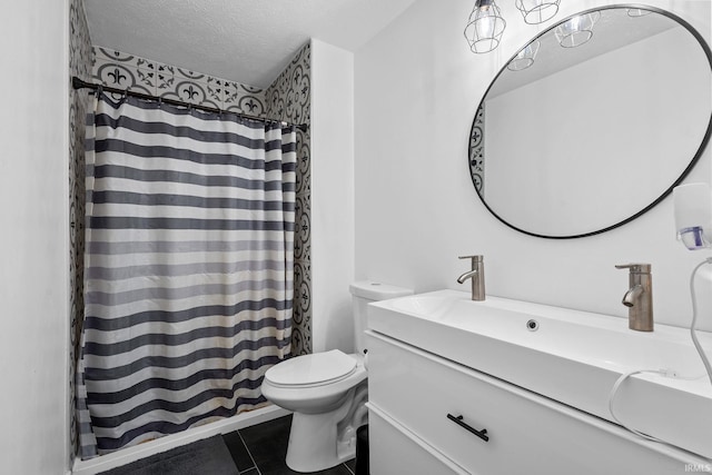 bathroom with curtained shower, toilet, a textured ceiling, vanity, and tile patterned flooring