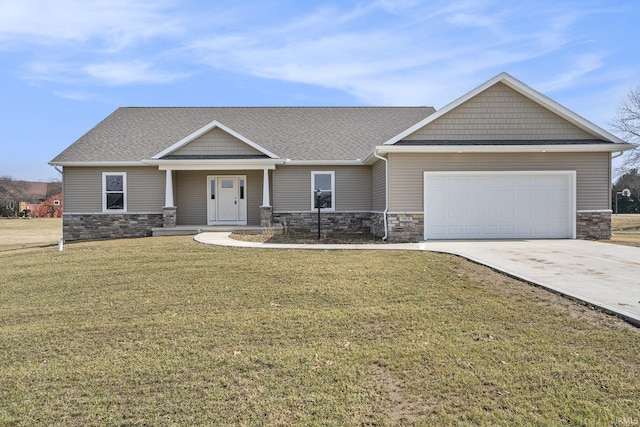 craftsman-style house featuring a garage, stone siding, driveway, and a front lawn