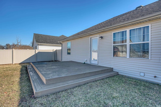 wooden terrace with fence and a lawn