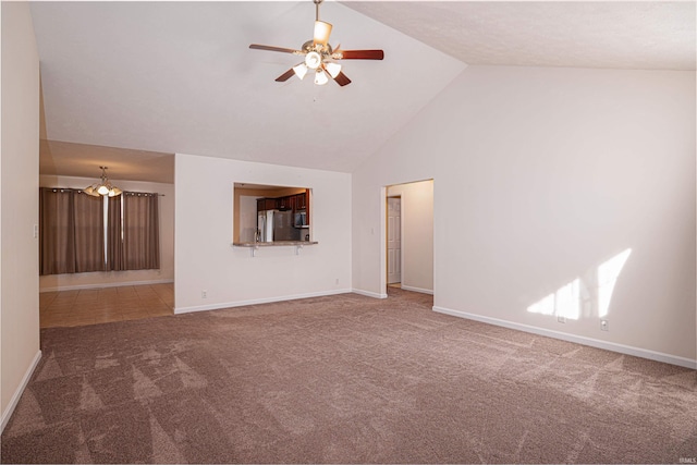 carpeted spare room with high vaulted ceiling, baseboards, and a ceiling fan