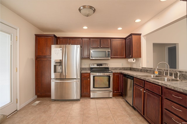 kitchen featuring visible vents, appliances with stainless steel finishes, light tile patterned flooring, a sink, and recessed lighting