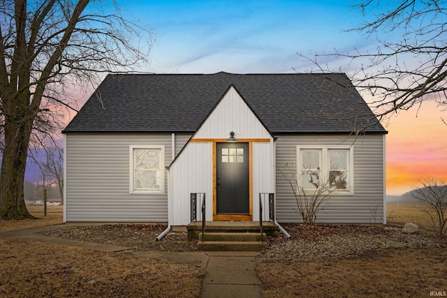 view of front of home featuring entry steps and a shingled roof