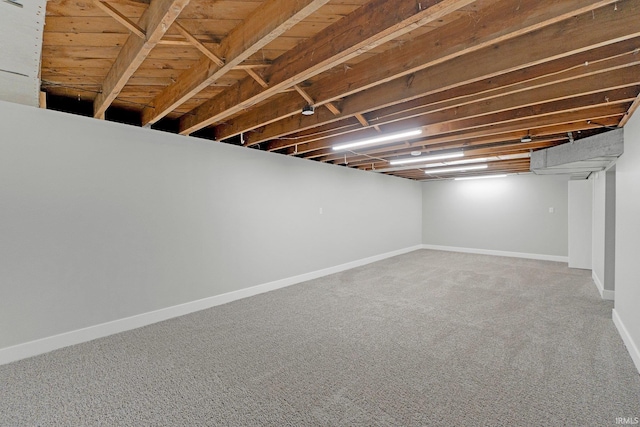 finished basement featuring carpet and baseboards