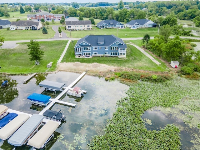 aerial view featuring a residential view and a water view