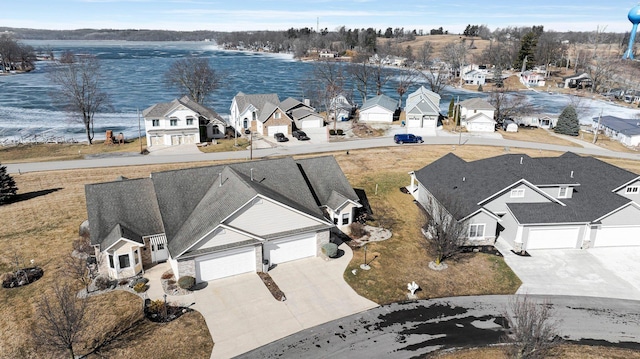 bird's eye view with a residential view and a water view