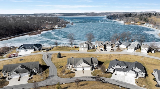 bird's eye view with a water view and a residential view