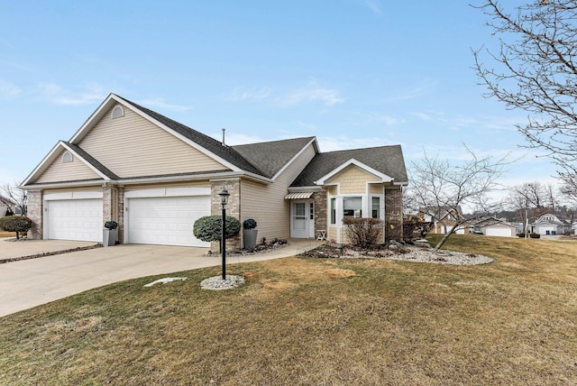 view of front of property featuring a garage, a front lawn, and concrete driveway