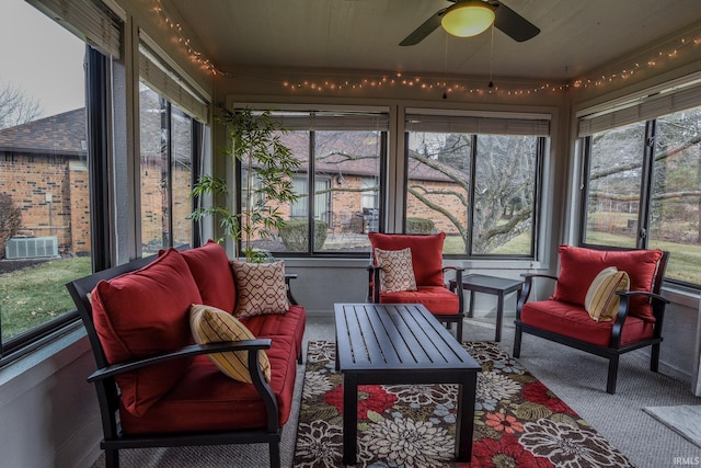 sunroom with a ceiling fan and a healthy amount of sunlight