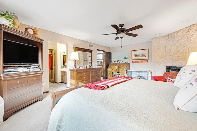 carpeted bedroom with ceiling fan and visible vents