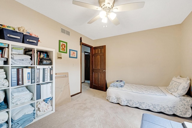 bedroom featuring carpet floors, ceiling fan, visible vents, and baseboards