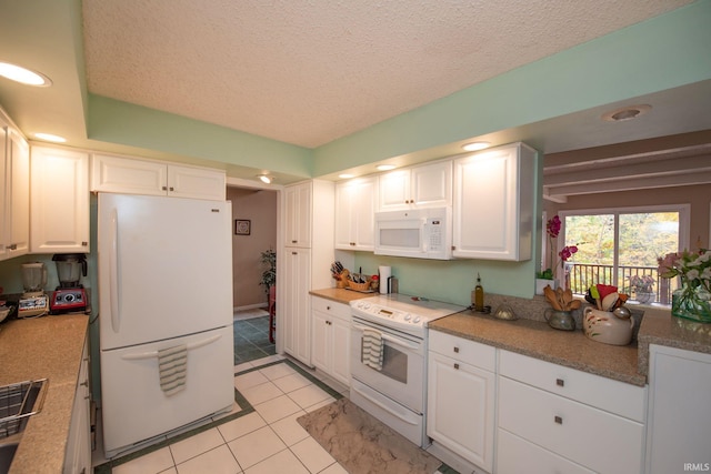 kitchen featuring white appliances, white cabinets, light tile patterned flooring, a textured ceiling, and recessed lighting