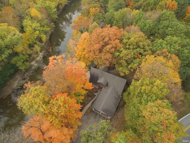 bird's eye view featuring a water view and a wooded view