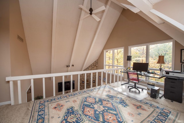 carpeted office featuring vaulted ceiling with beams, visible vents, and baseboards