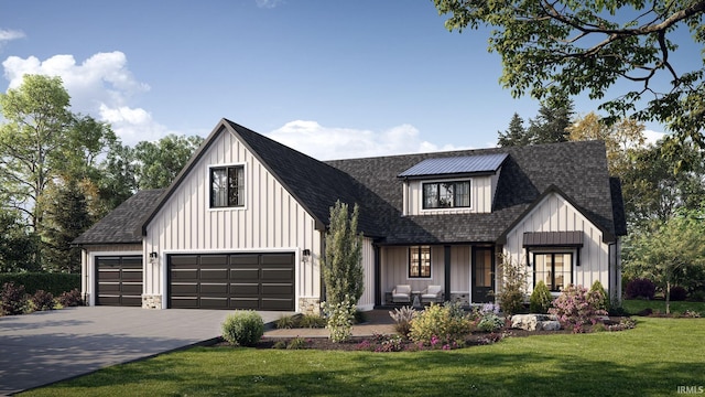 modern farmhouse featuring roof with shingles, board and batten siding, a front yard, stone siding, and driveway