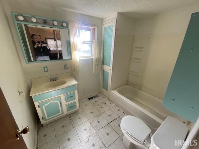 bathroom with a textured ceiling, toilet, shower / bath combination, visible vents, and vanity