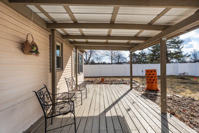 wooden terrace featuring a fenced backyard