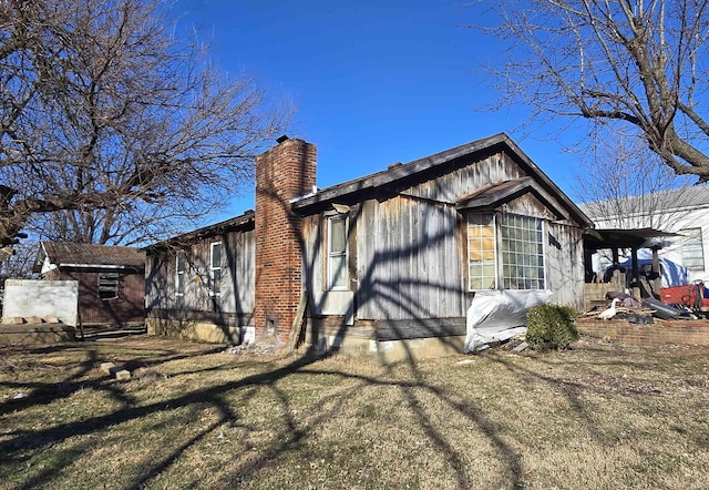 view of side of property featuring a chimney