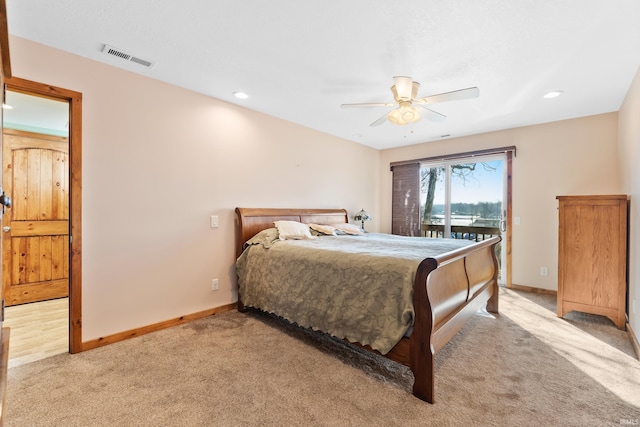 bedroom featuring access to outside, light carpet, visible vents, and baseboards