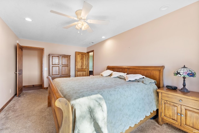 bedroom featuring light carpet, ceiling fan, recessed lighting, and baseboards