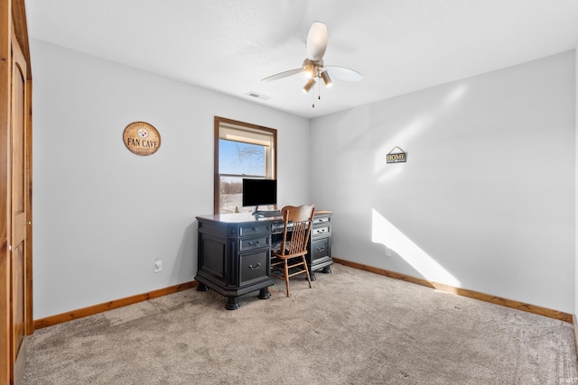 carpeted office with a ceiling fan, visible vents, and baseboards