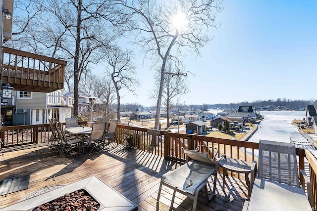 wooden deck featuring an outdoor fire pit and outdoor dining area