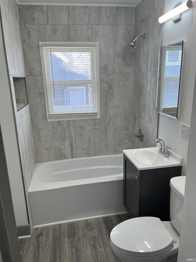 bathroom featuring shower / bathing tub combination, vanity, toilet, and wood finished floors