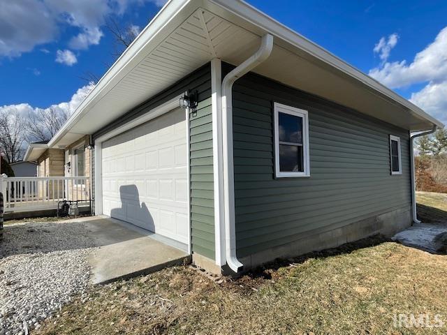 view of side of home with crawl space